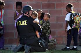 Image result for police officers helping people